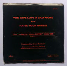 Bon Jovi - You Give Love A Bad Name , Raise Your Hands . ( EP , 45 RPM )